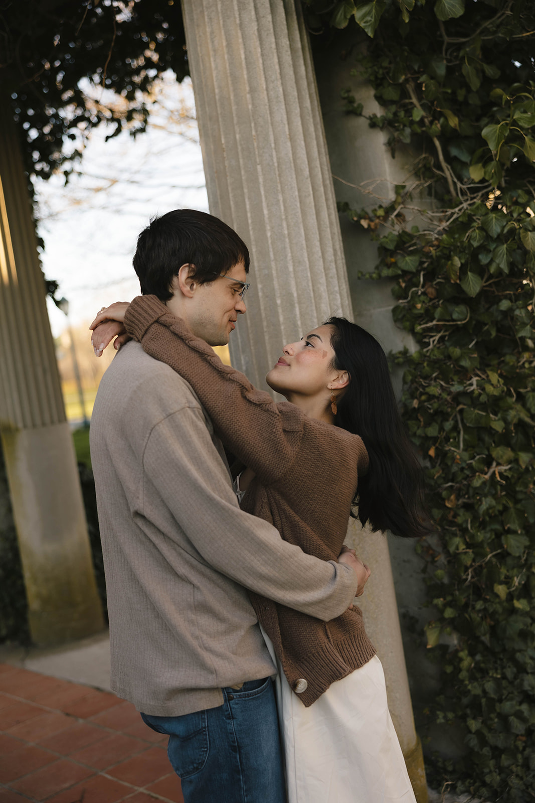 Couple captured underneath the pergola at Harkness Memorial State Park