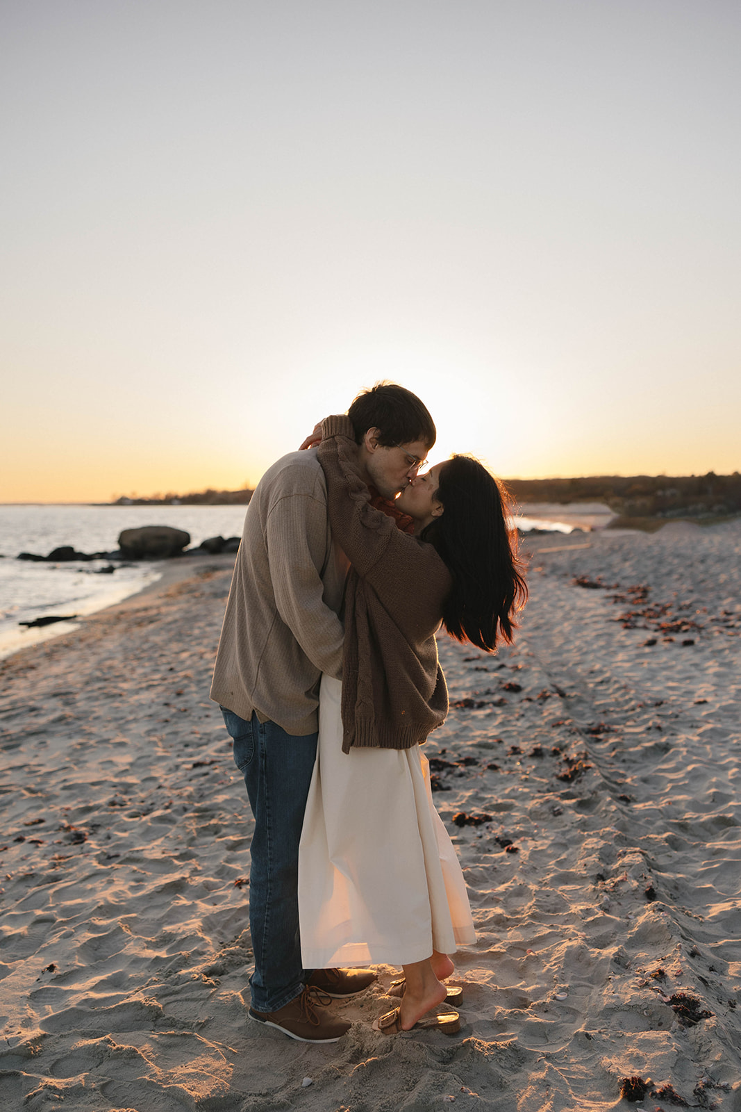 Sunset kiss by the water at Harkness Memorial State Park