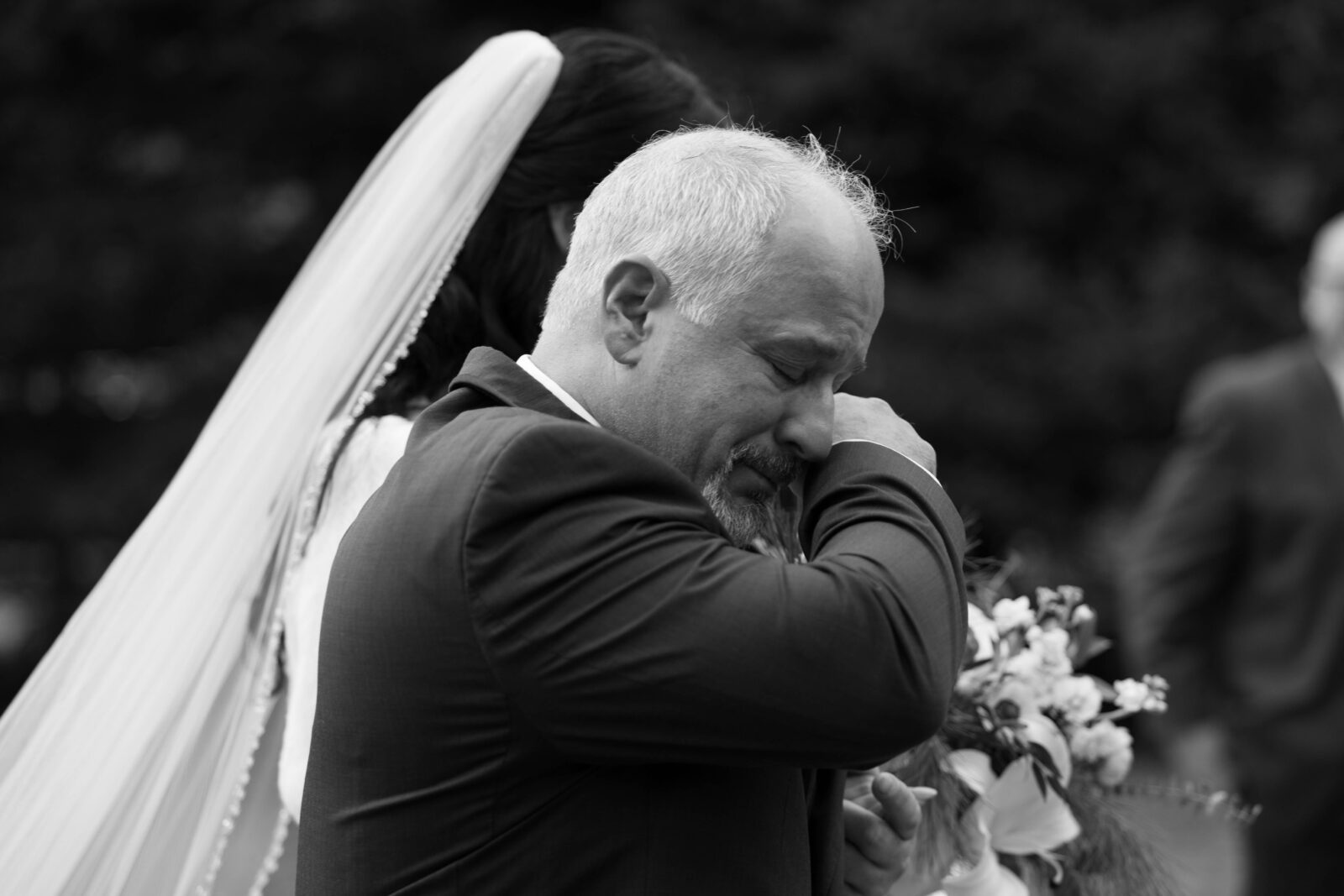 Caitlins father cries as he walks her down the aisle