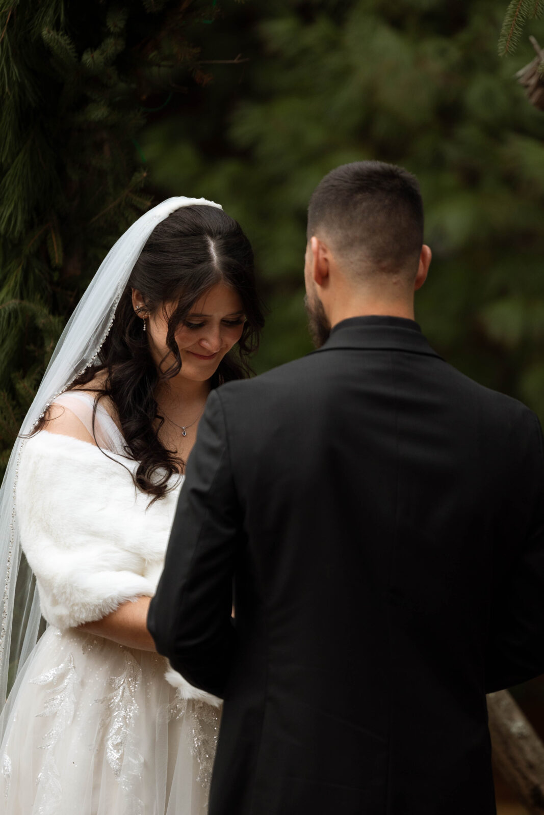 Emotional moment of Caitlin and David holding hands during vows