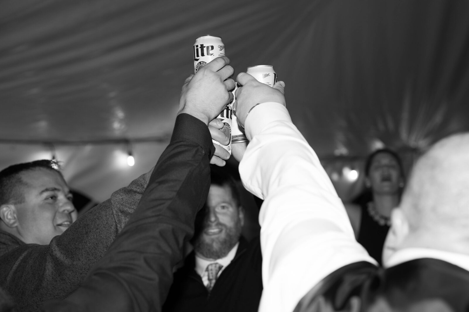 Wedding guests toasting on dancefloor