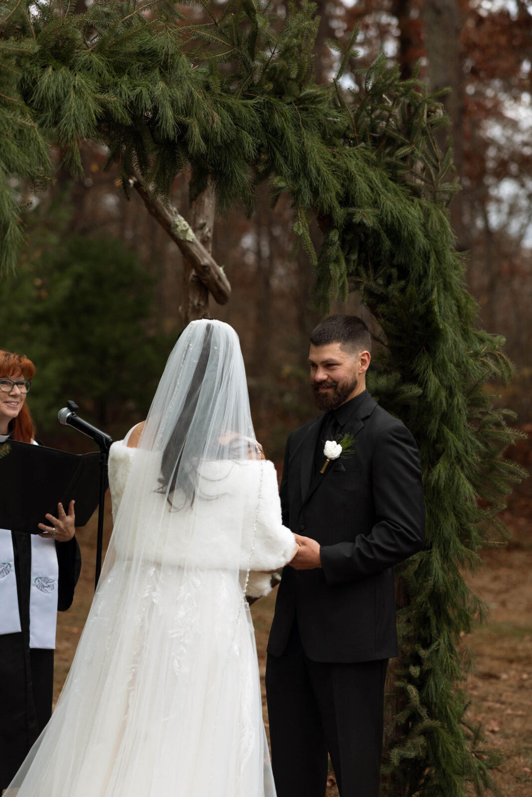Emotional moment of Caitlin and David holding hands during vows