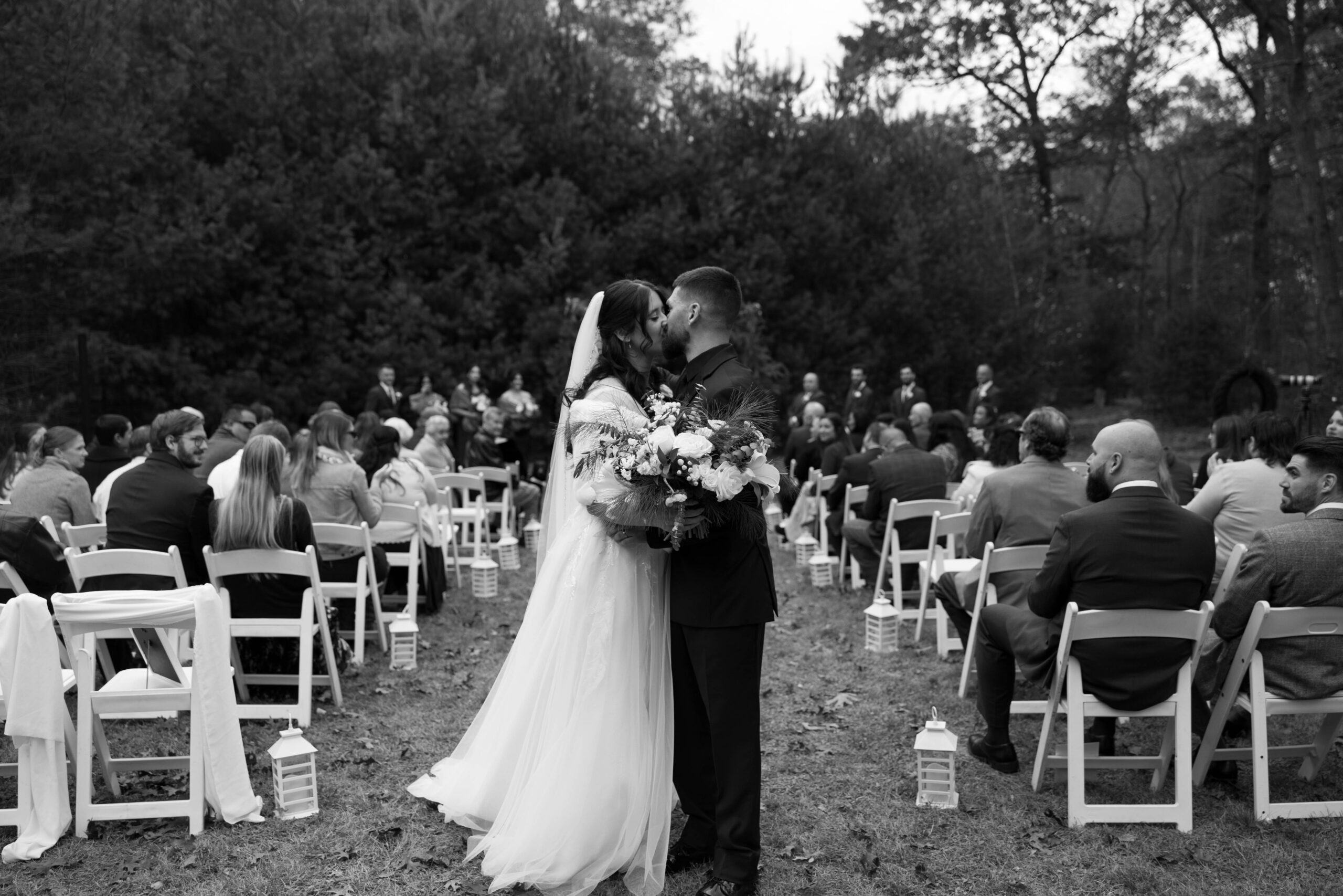 Just married moment: Caitlin and David kissing after walking back down the aisle.
