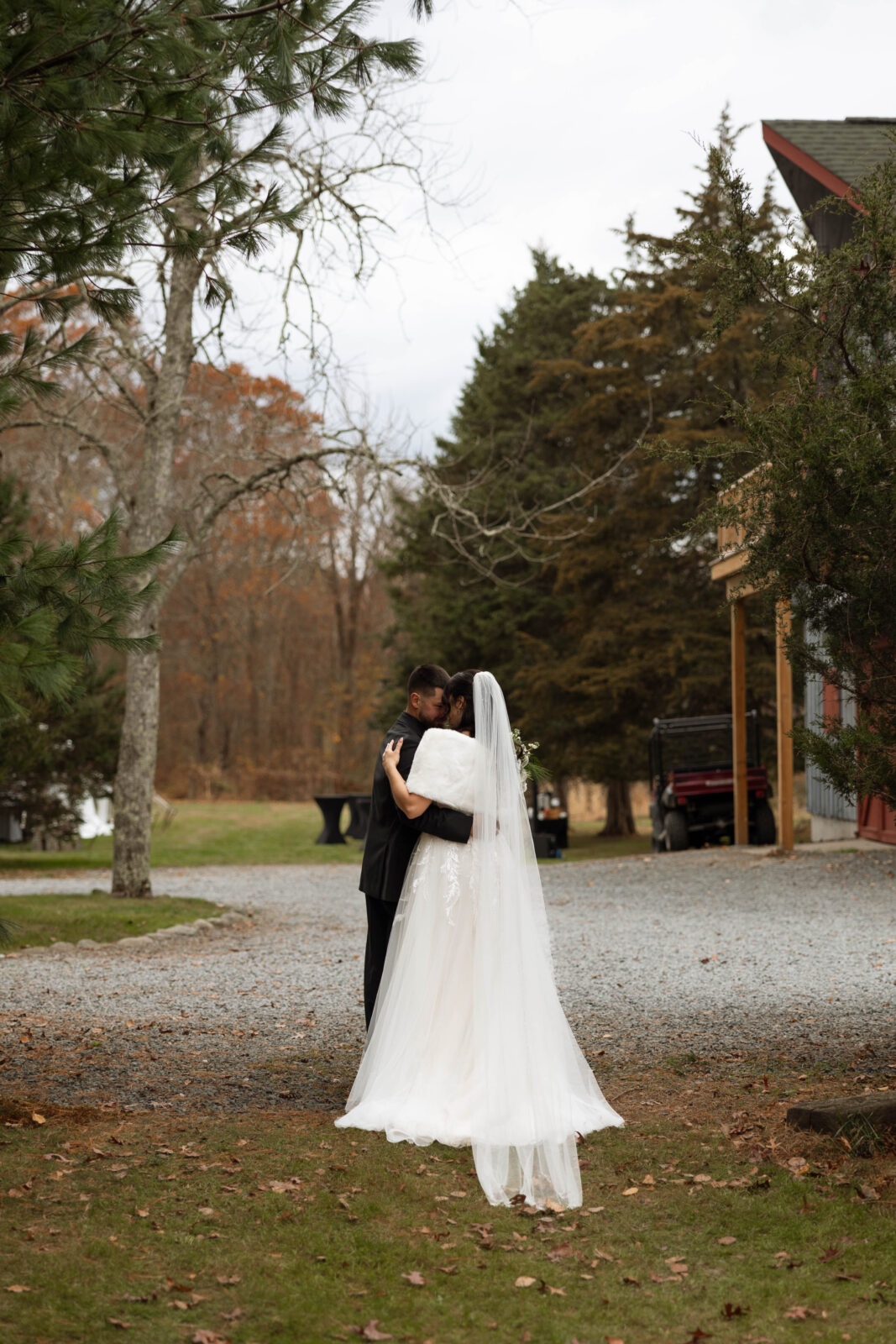 Caitlin and David sharing a private moment under a tree