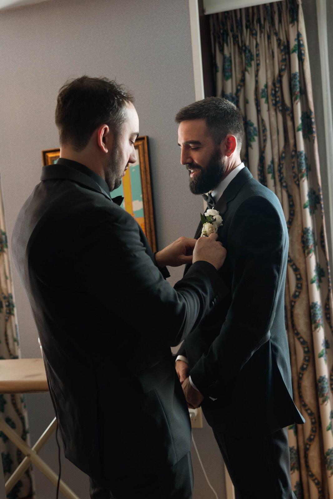 Dylan helping his groomsman get ready | Providence RI Wedding