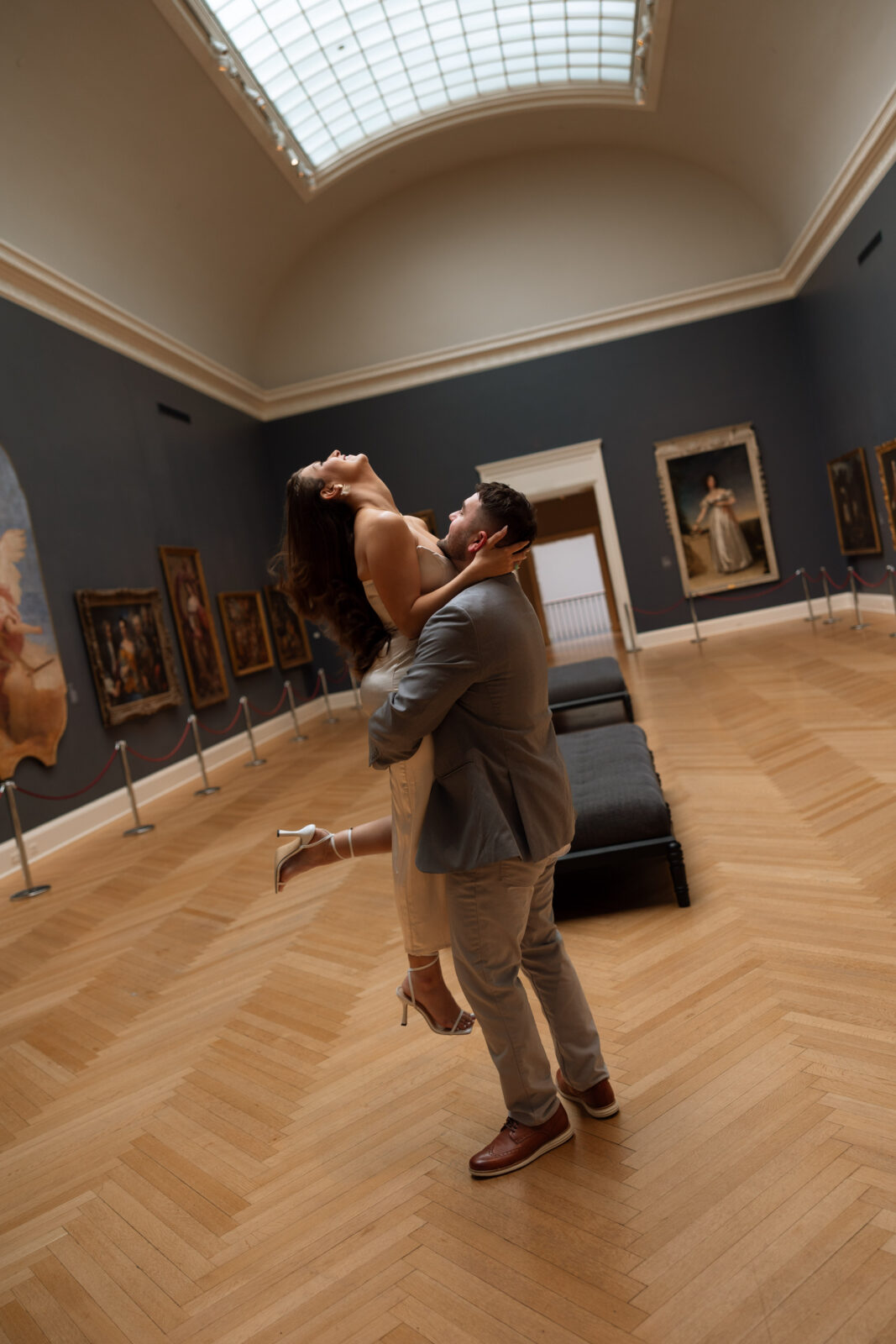 Couple embracing in art museum