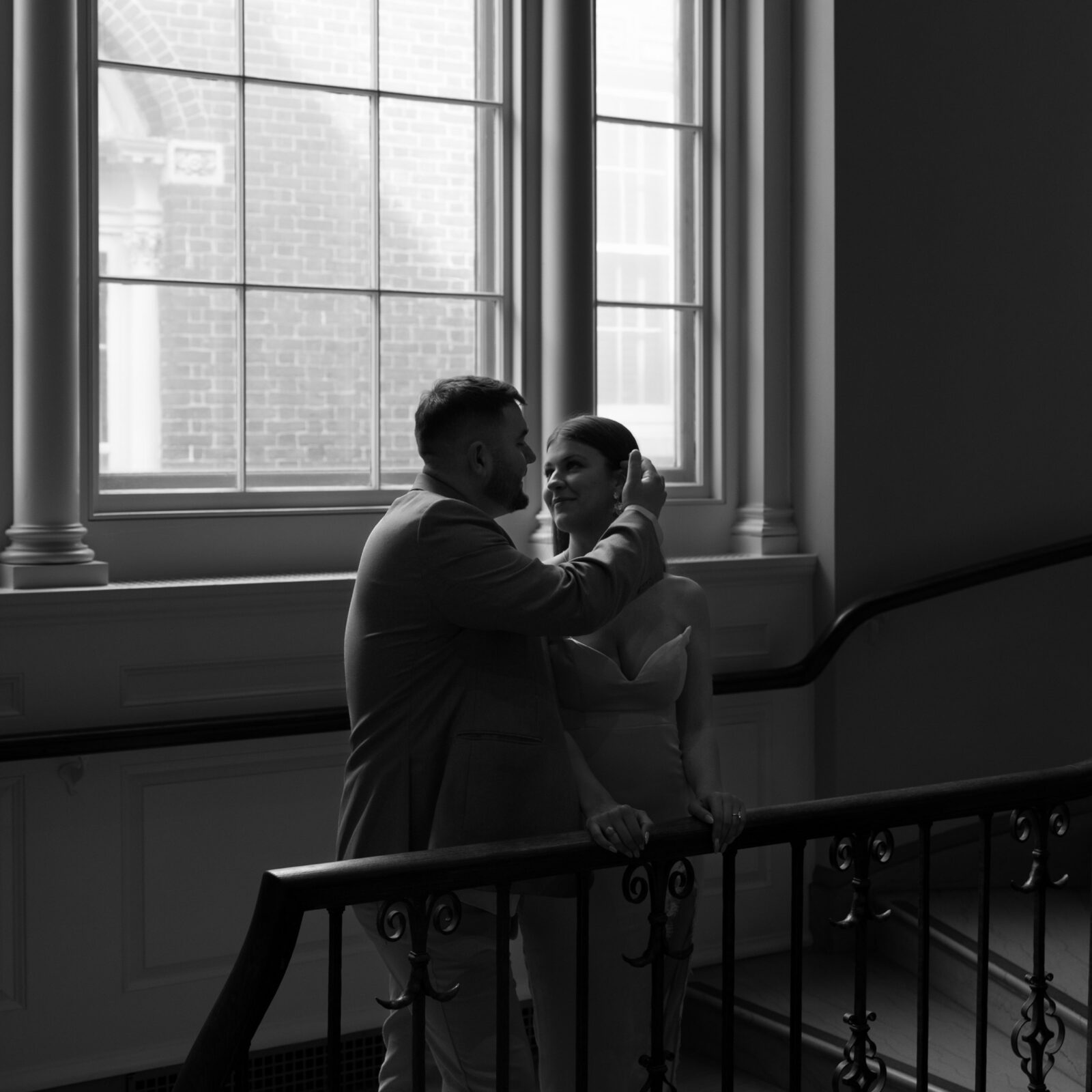 Blake embracing Tori in the stairwell