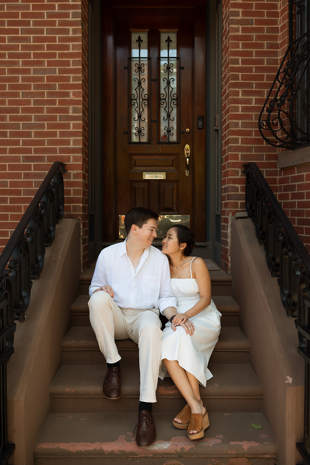 Couple posing on steps in Back bay