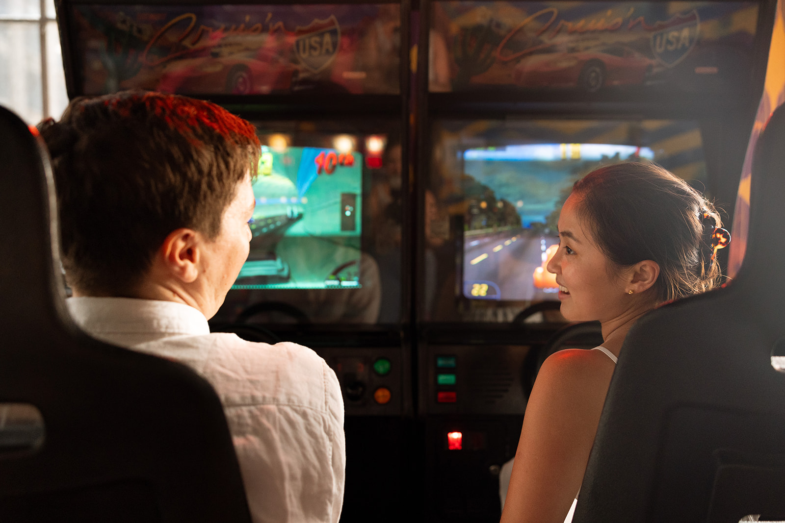 Couple playing arcade games