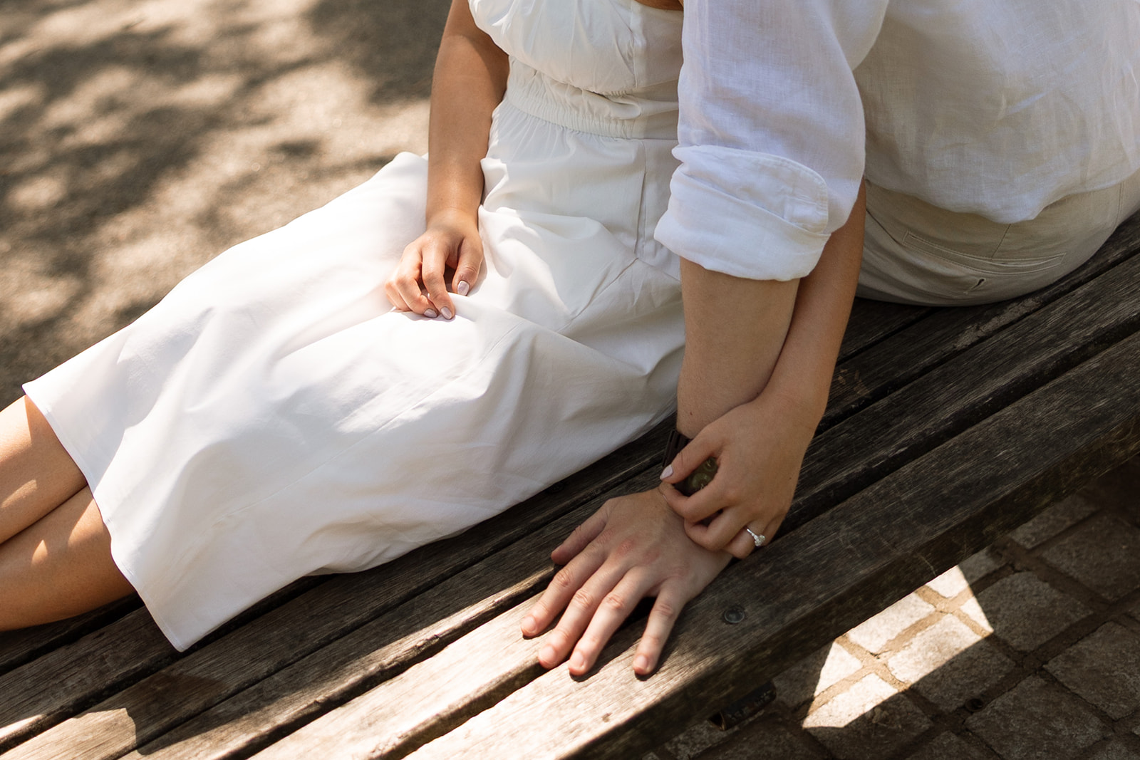 Couple embracing on bench in Boston Public Garden