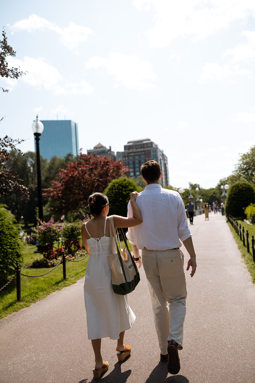 Couple walking through Boston Public Gardens
